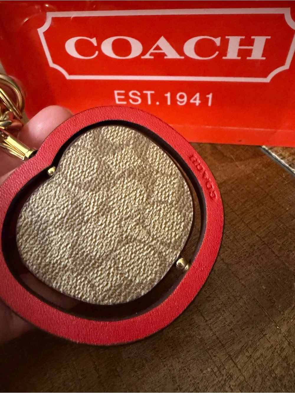 Coach Swivel Apple Charm